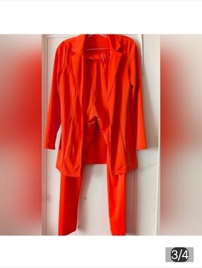 Women's Orange Suit Says M, But is really a size 0.